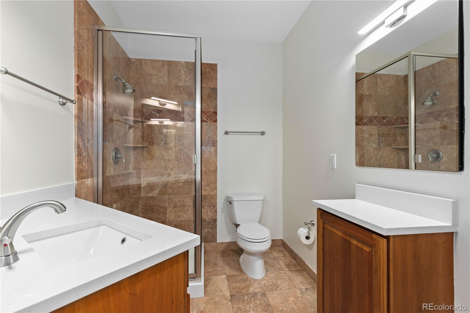 475 West 12th Avenue, Unit 6G Denver, CO 80204 - Photo 19 of 44 a bathroom with a sink a toilet and shower