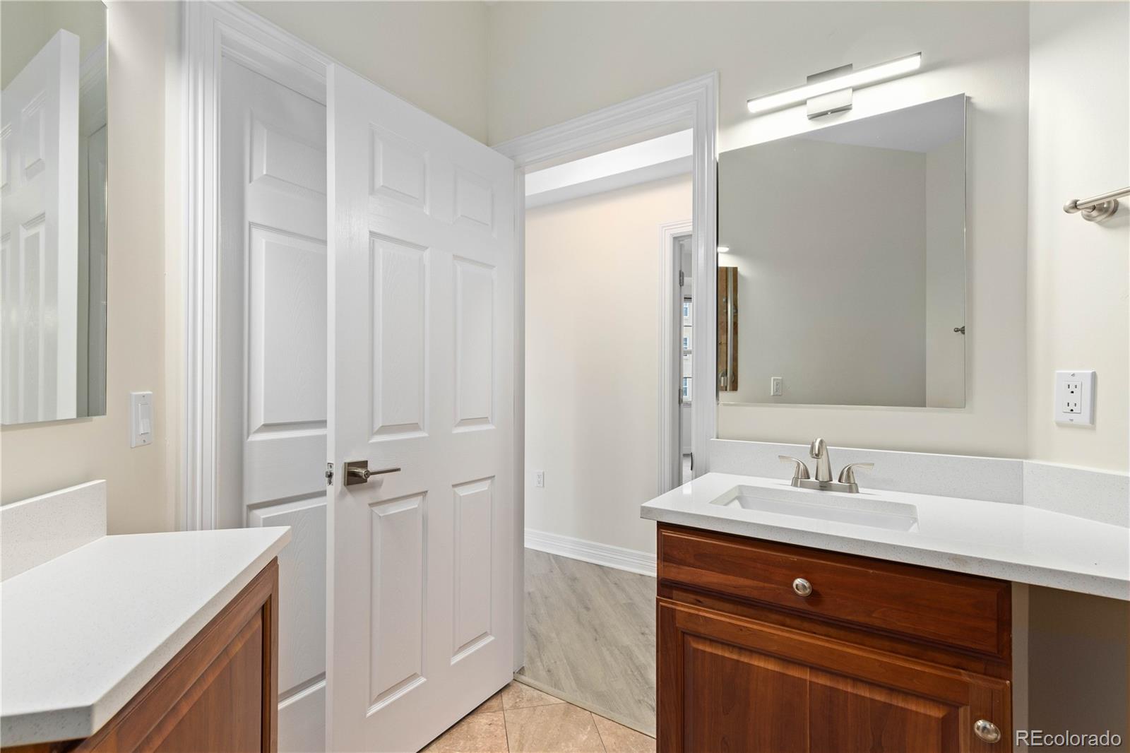 475 West 12th Avenue, Unit 6G Denver, CO 80204 - Photo 20 of 44 a bathroom with a sink and a mirror
