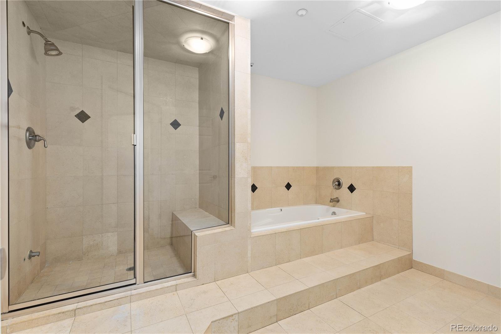 475 West 12th Avenue, Unit 6G Denver, CO 80204 - Photo 24 of 44 a bathroom with a bathtub a shower and a sink