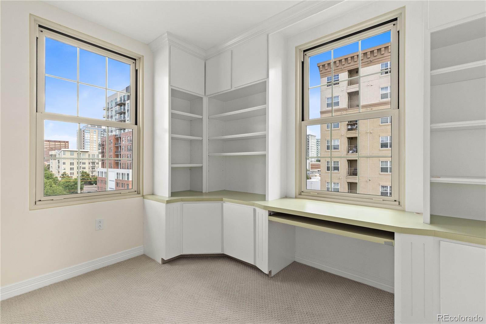 475 West 12th Avenue, Unit 6G Denver, CO 80204 - Photo 29 of 44 a room with a wooden floor and cabinets
