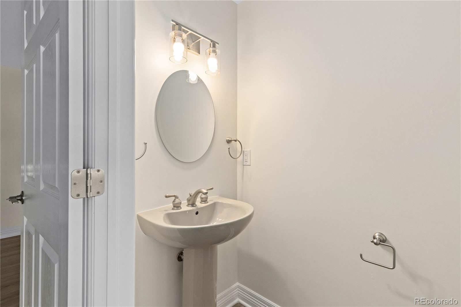 475 West 12th Avenue, Unit 6G Denver, CO 80204 - Photo 32 of 44 a bathroom with a sink and a mirror