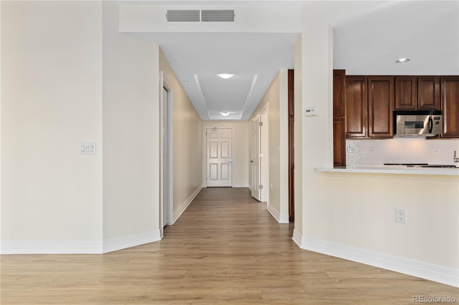 475 West 12th Avenue, Unit 6G Denver, CO 80204 - Photo 8 of 44 a view of a hallway view with wooden floor