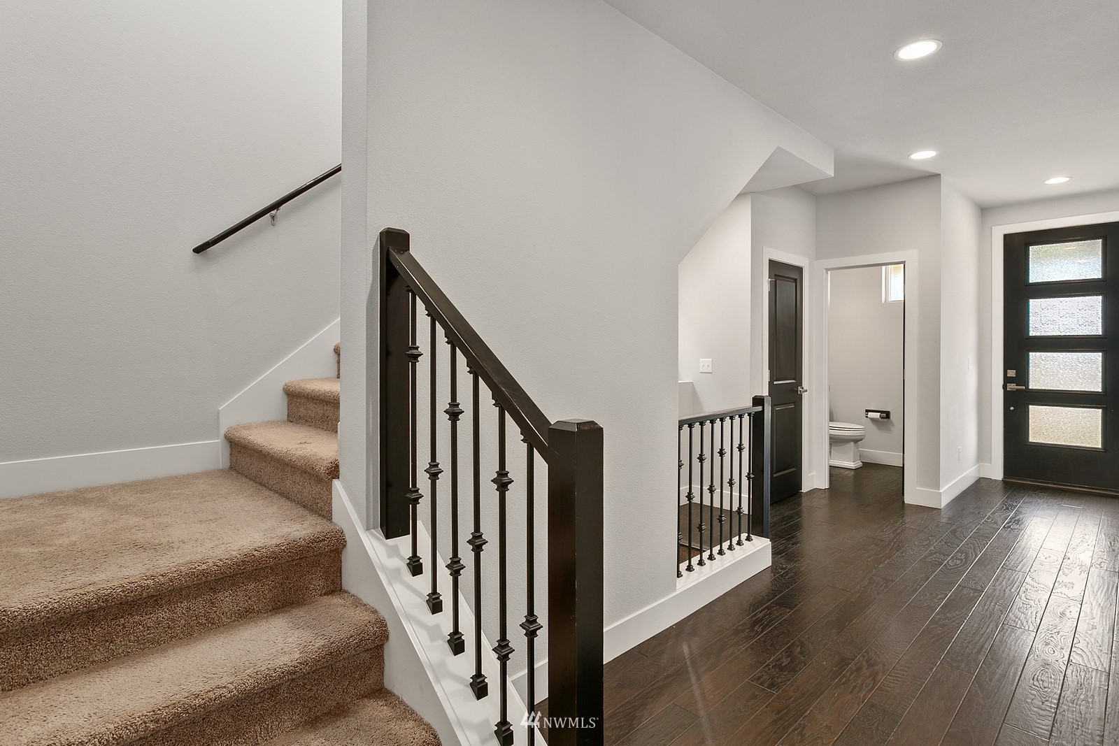 20527 Richmond Road Bothell, WA 98012 - Photo 16 of 40 a view of a hallway with wooden floor and staircase