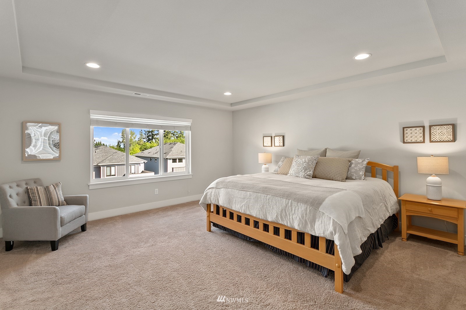 20527 Richmond Road Bothell, WA 98012 - Photo 17 of 40 a bed sitting in a spacious bedroom next to a window