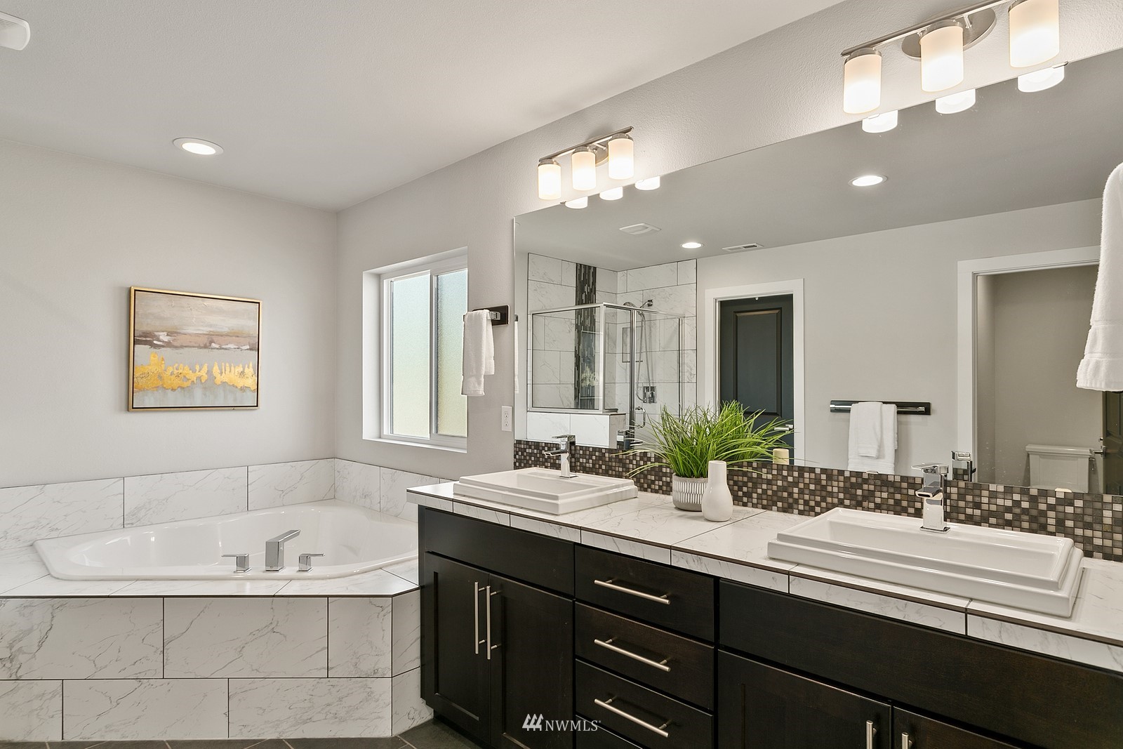 20527 Richmond Road Bothell, WA 98012 - Photo 19 of 40 a bathroom with a large tub sink and double vanity