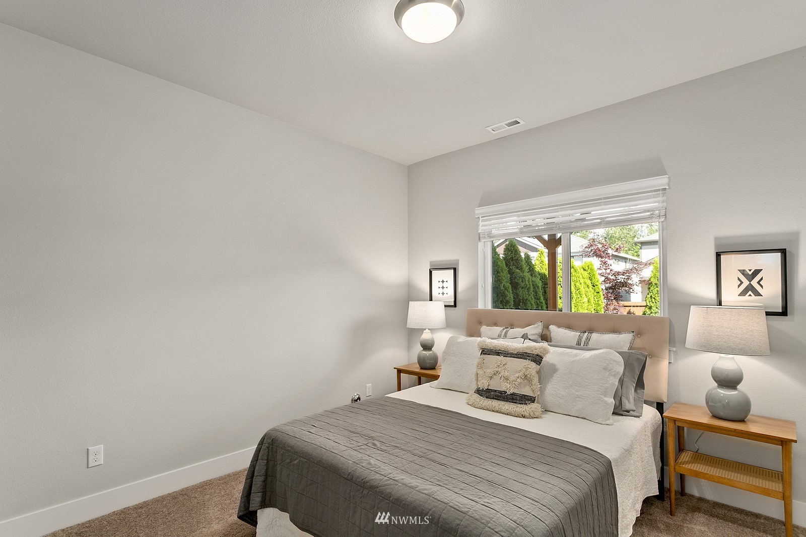 20527 Richmond Road Bothell, WA 98012 - Photo 29 of 40 a bedroom with a bed and a couch