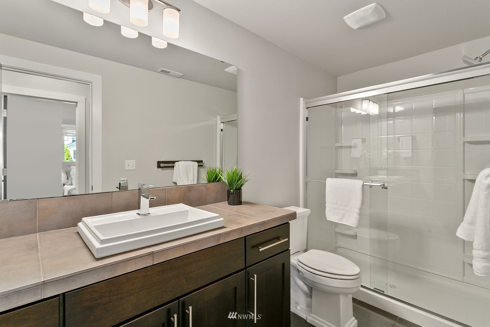 20527 Richmond Road Bothell, WA 98012 - Photo 30 of 40 a bathroom with a sink a toilet and shower