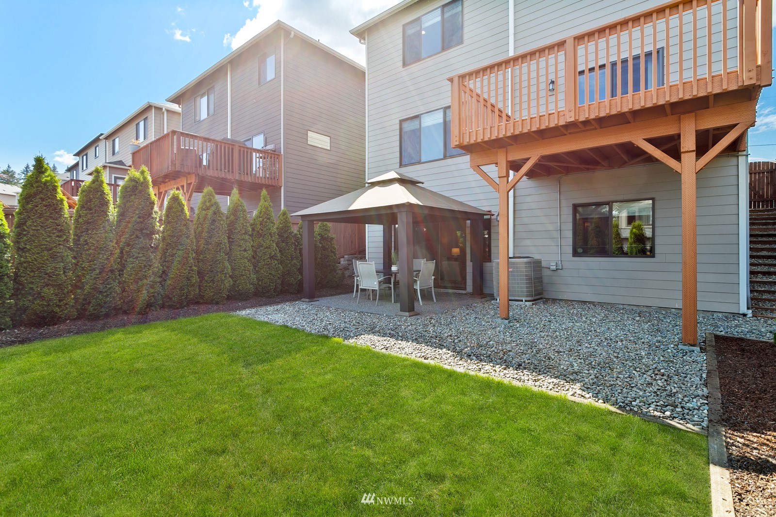 20527 Richmond Road Bothell, WA 98012 - Photo 32 of 40 a view of a house with backyard and porch