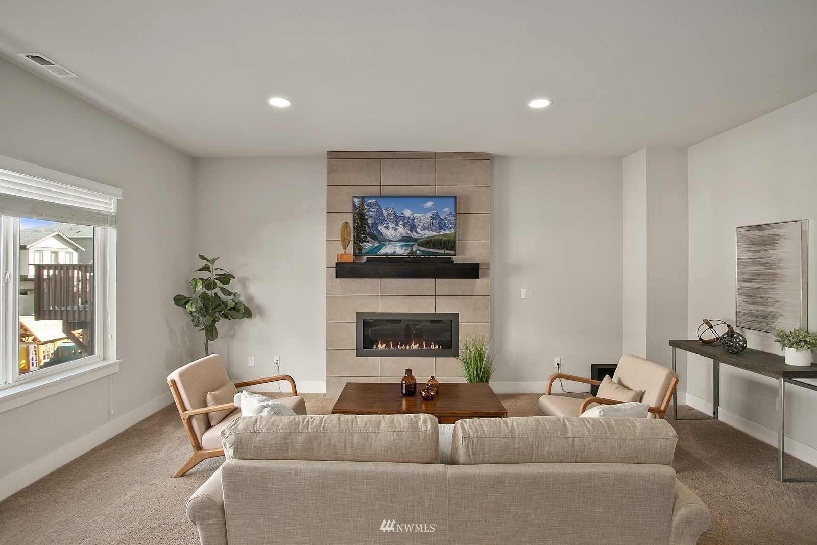 20527 Richmond Road Bothell, WA 98012 - Photo 4 of 40 a living room with furniture a fireplace and a window