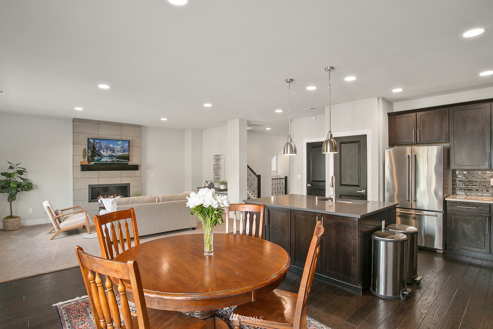 20527 Richmond Road Bothell, WA 98012 - Photo 9 of 40 a dining room with stainless steel appliances furniture a dining table and chairs