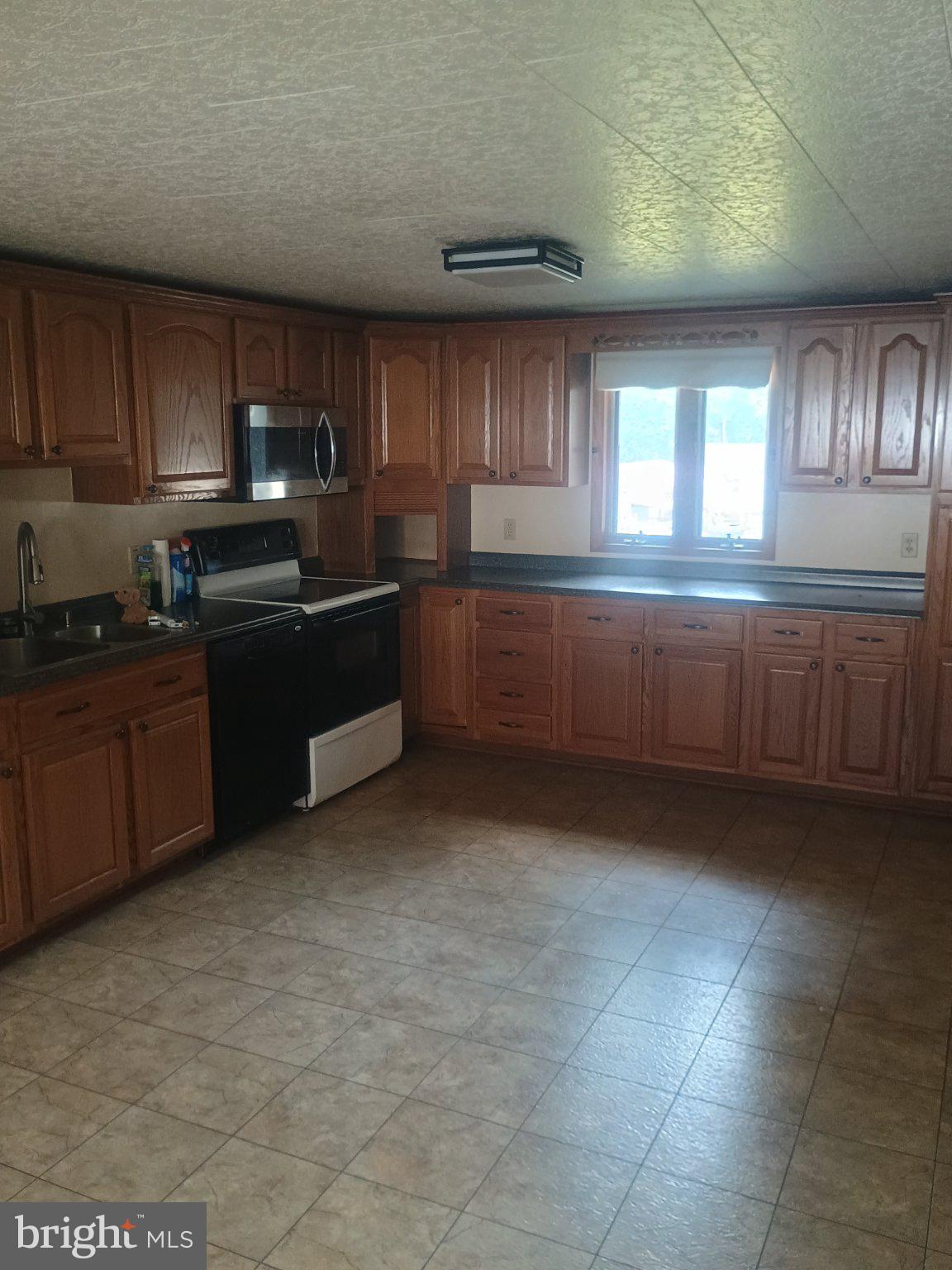 306 Ridgley Street Orbisonia, PA 17243 - Photo 6 of 21 Spacious kitchen with warm wood tones.