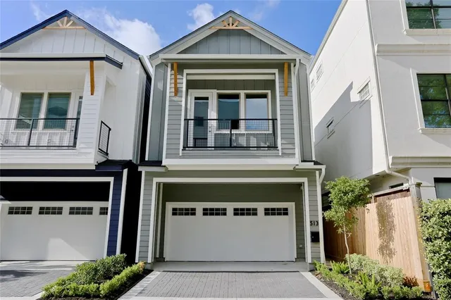 a front view of a house with a garage