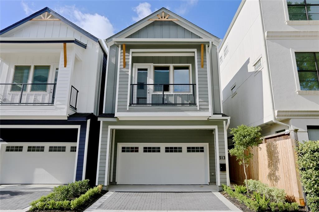 a front view of a house with a garage