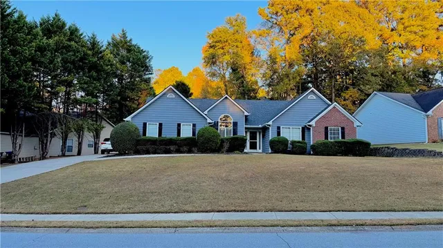 a front view of a house with a yard