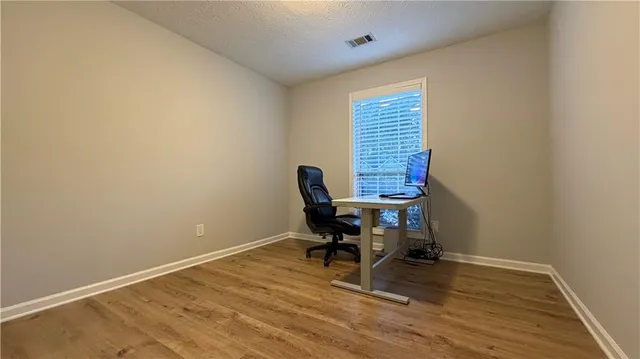 a workspace with furniture and a window