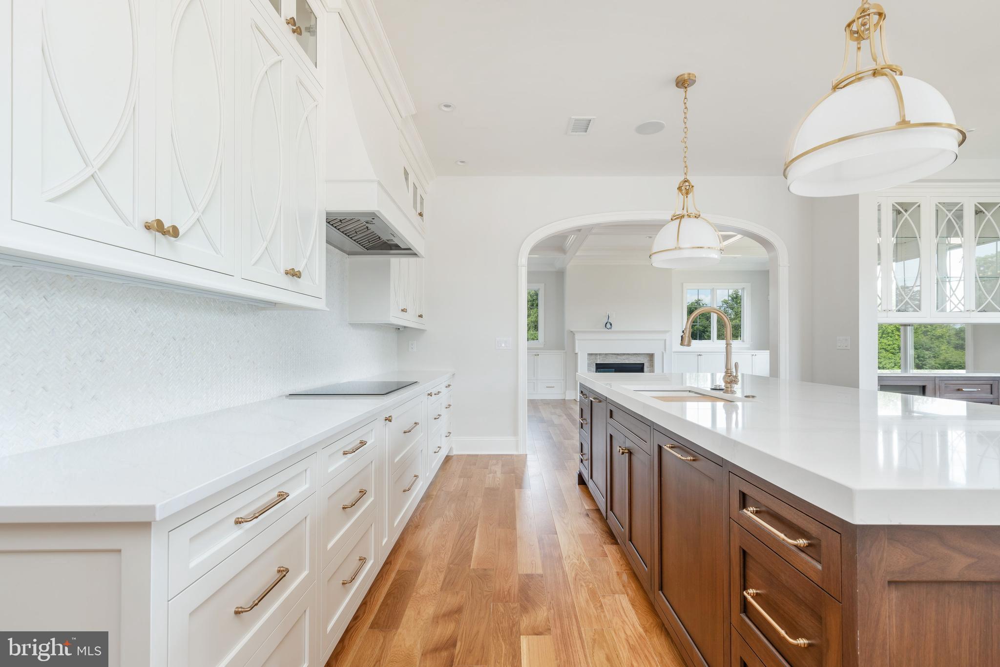 406 Barclay Road Bryn Mawr, PA 19010 - Photo 13 of 26 a large kitchen with stainless steel appliances granite countertop a lot of counter space and wooden floors