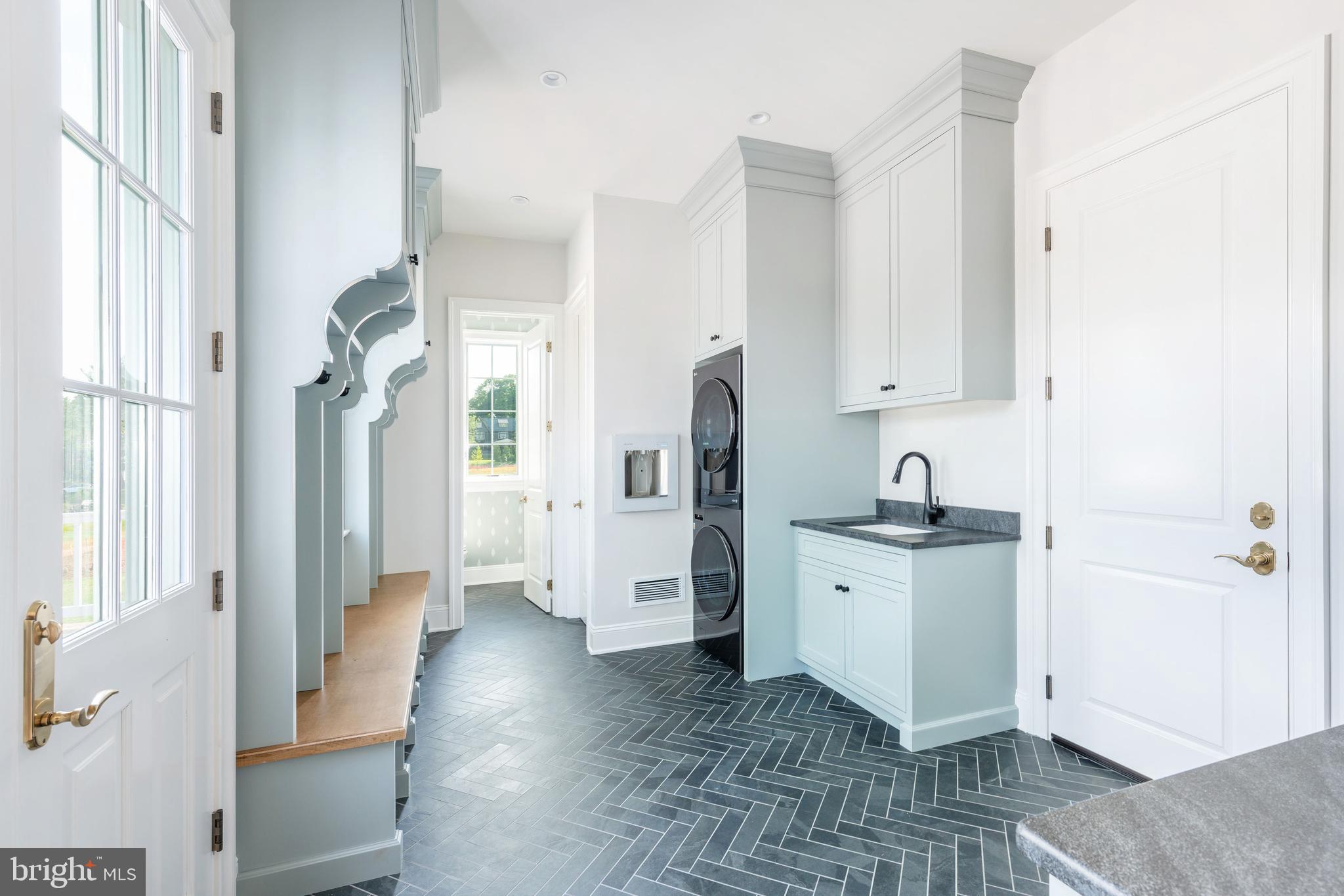 406 Barclay Road Bryn Mawr, PA 19010 - Photo 17 of 26 a view of a kitchen with white cabinets