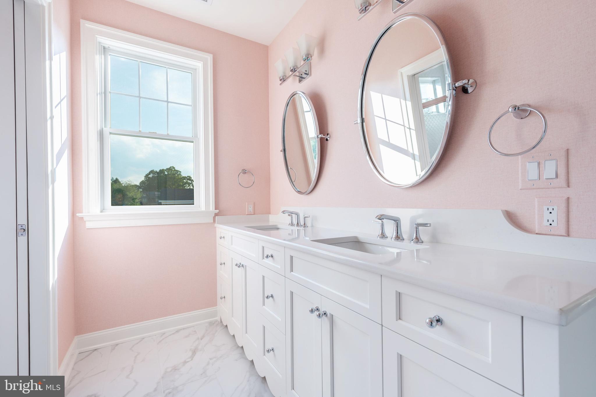 406 Barclay Road Bryn Mawr, PA 19010 - Photo 25 of 26 a bathroom with a double vanity sink and a mirror