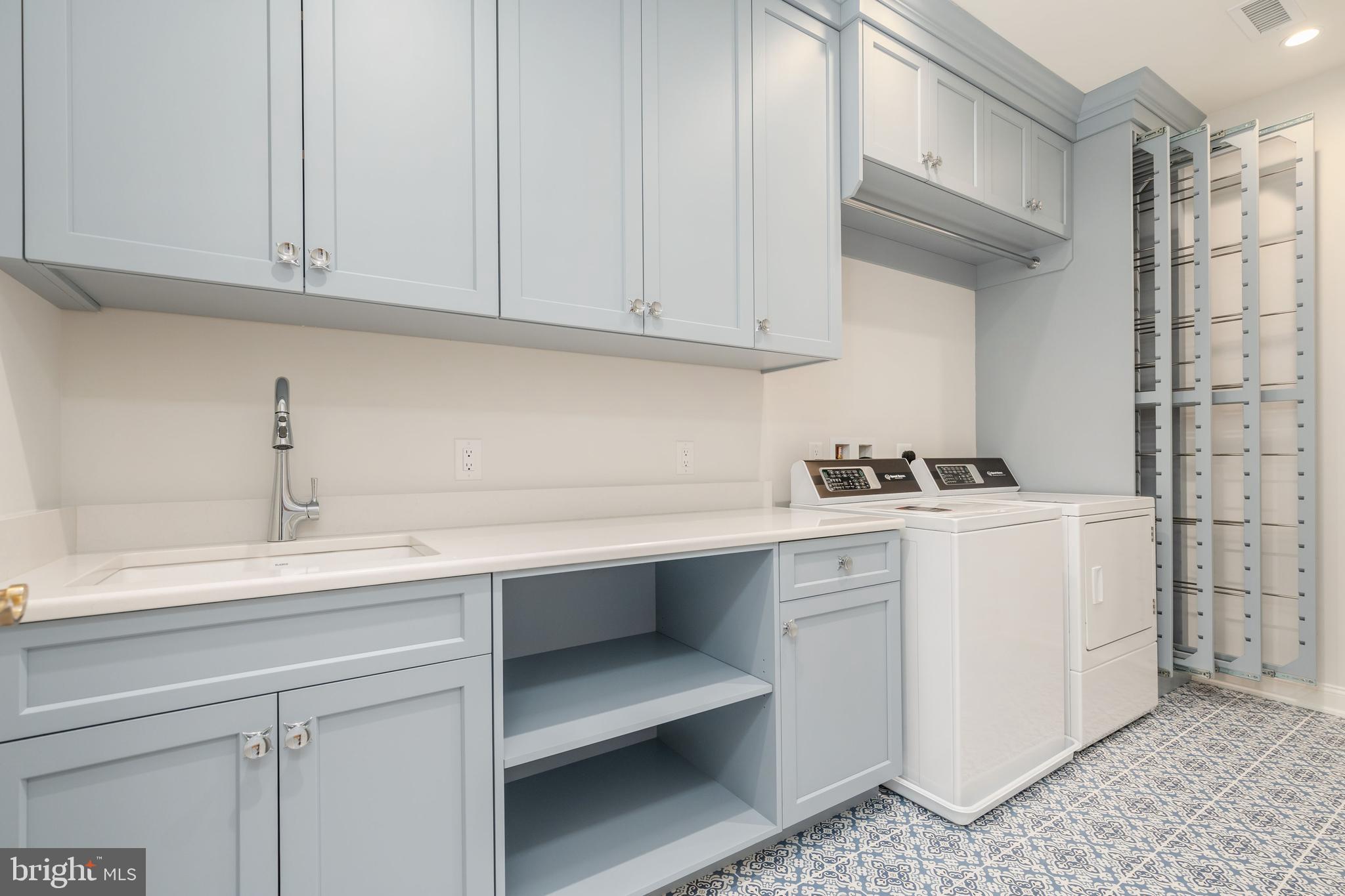 406 Barclay Road Bryn Mawr, PA 19010 - Photo 26 of 26 a kitchen with stainless steel appliances granite countertop a sink dishwasher a stove and white cabinets with wooden floor