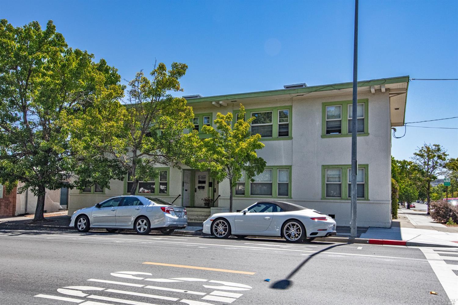 a view of a cars parked in front of a building