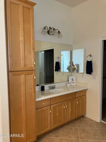 a bathroom with a double vanity sink and mirror