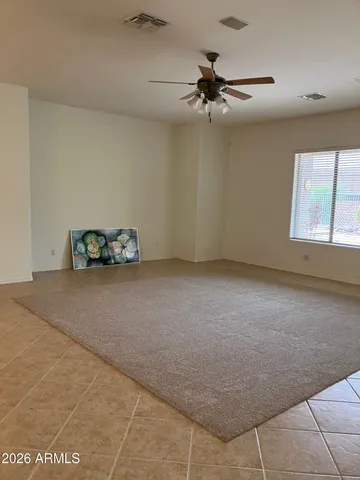 a view of room with a ceiling fan