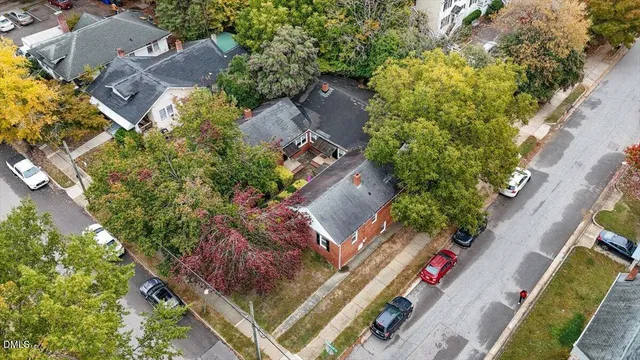 an aerial view of a house with a yard