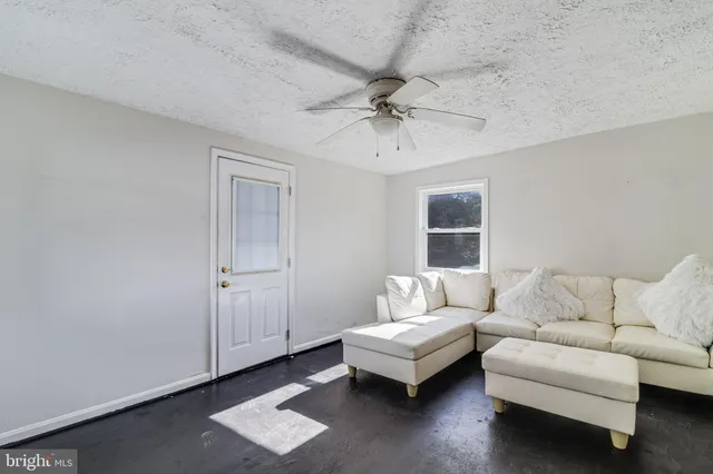 a bathroom with a sink vanity mirror and toilet