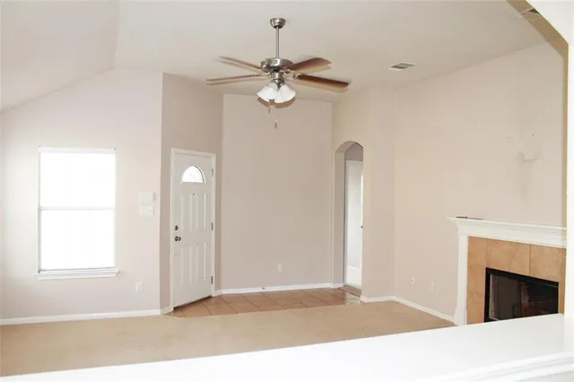 a view of livingroom with fireplace and window