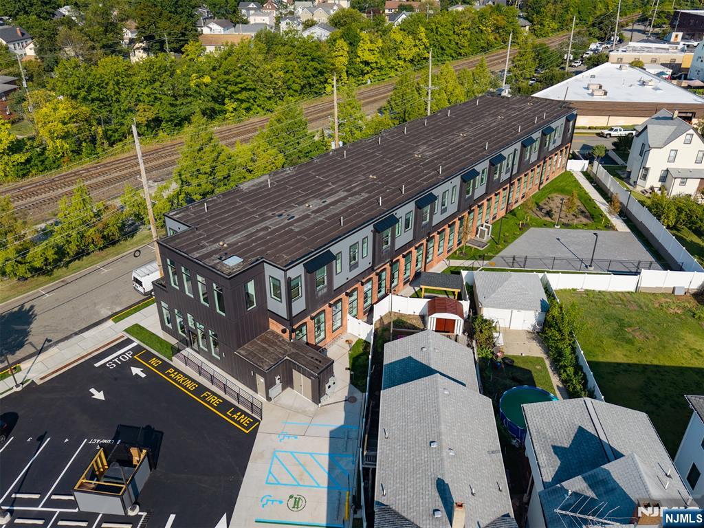315 Railroad Avenue, Unit 114 East Rutherford, NJ 07073 - Photo 27 of 28 an aerial view of a house with a big yard