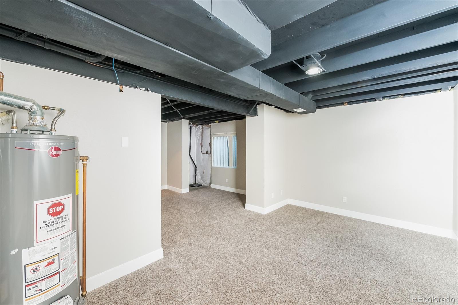 2229 South Truckee Street Aurora, CO 80013 - Photo 14 of 18 a view of storage and utility room