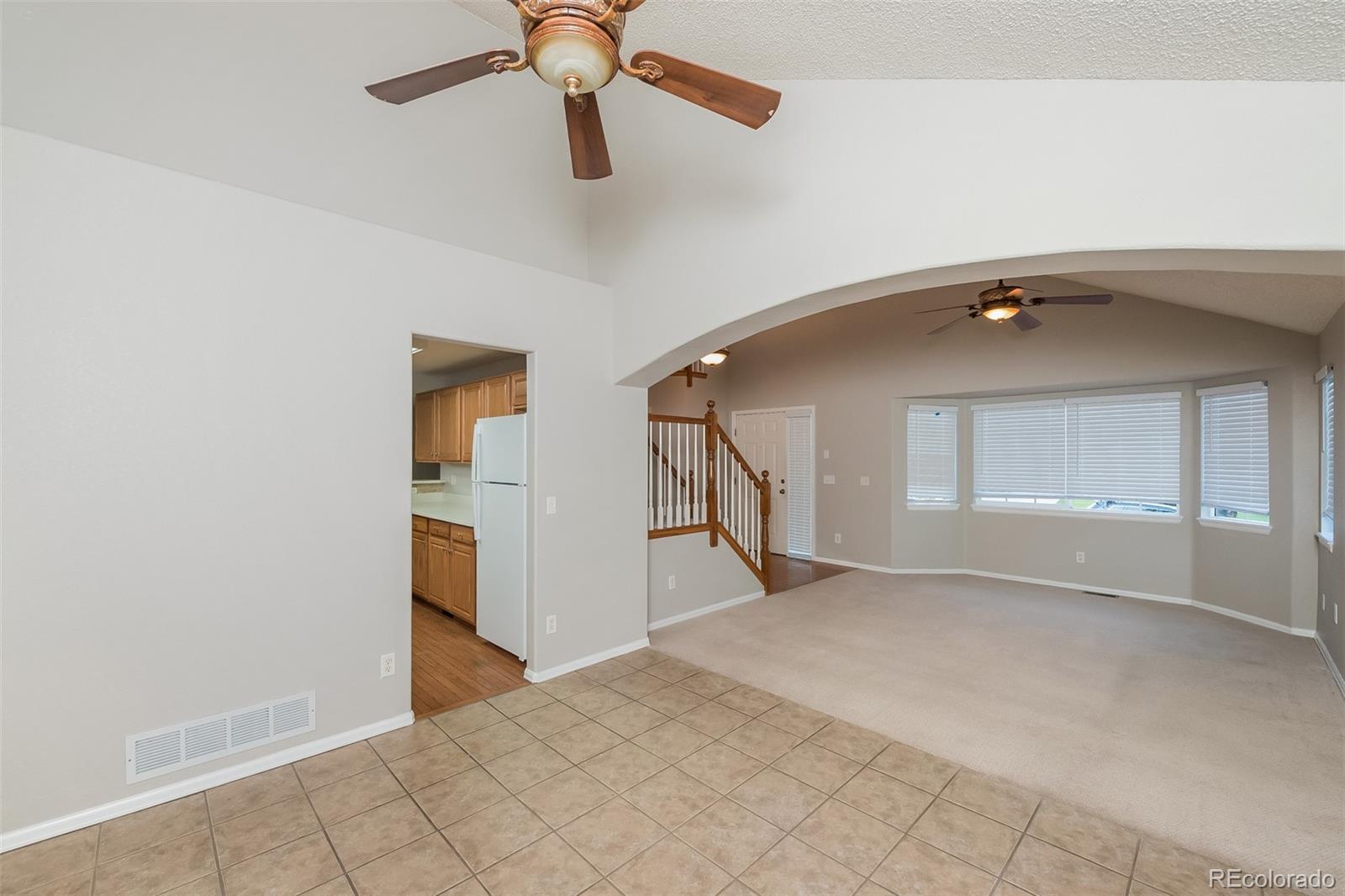 2229 South Truckee Street Aurora, CO 80013 - Photo 3 of 18 a view of a livingroom with a staircase