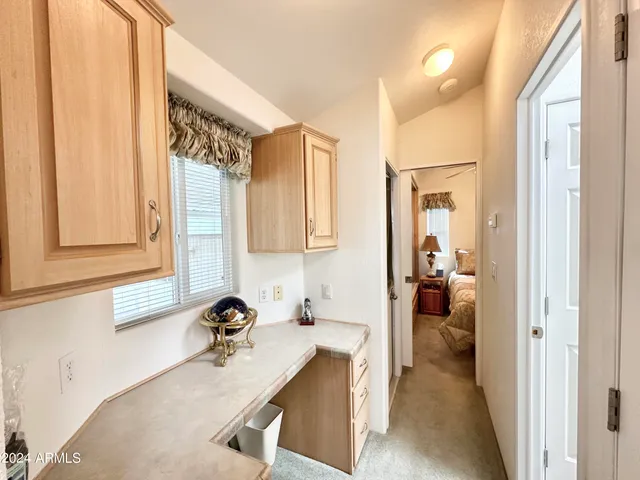a view of a bathroom with a sink and a mirror