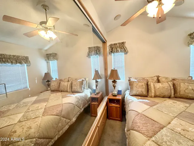 a bed room with a bed and a chandelier