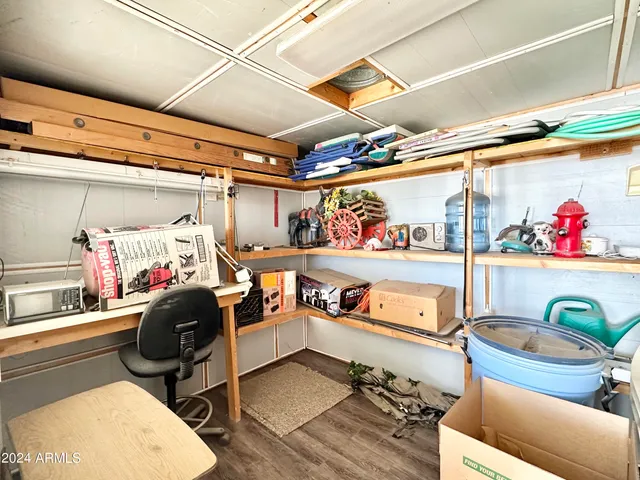 a utility room with dryer washer and a table