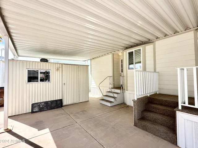 a living room with furniture and white walls