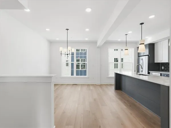 a view of kitchen with wooden floor and window