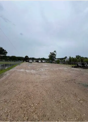 a view of a lake with houses in the back