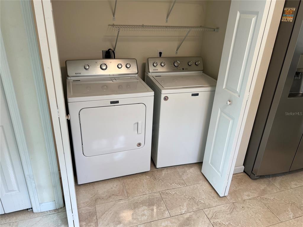 510 Mistletoe Court, Unit D Safety Harbor, FL 34695 - Photo 6 of 18 a utility room with dryer and washer