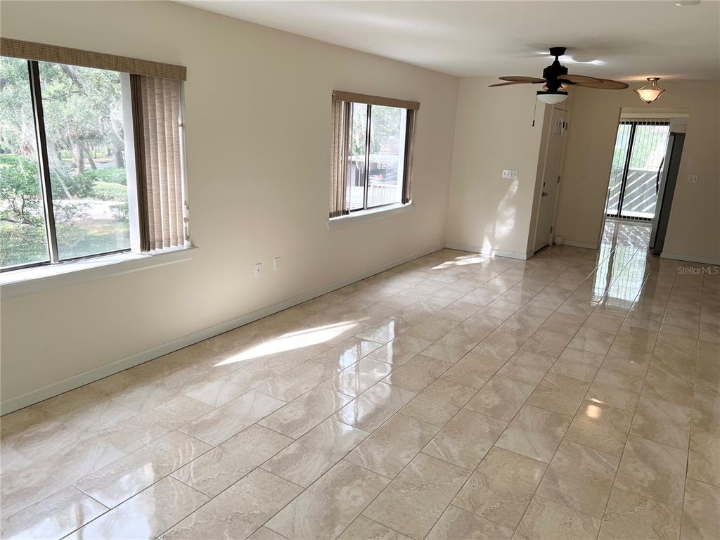 510 Mistletoe Court, Unit D Safety Harbor, FL 34695 - Photo 8 of 18 a view of an empty room with a window