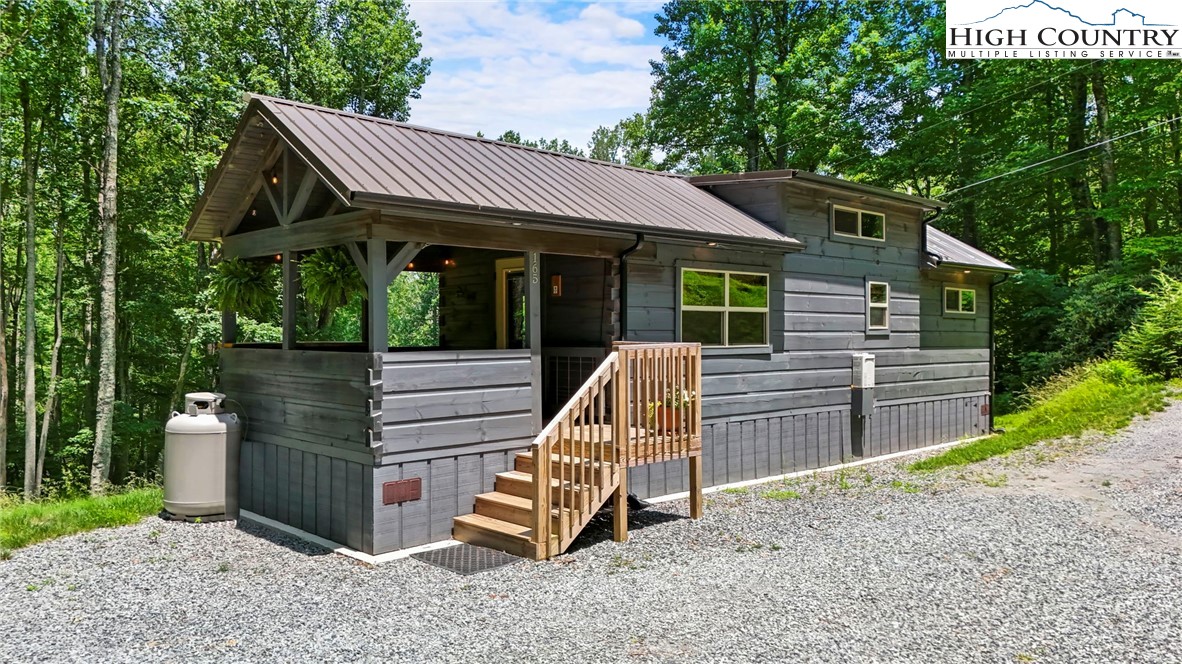 a view of a house with a sink and wooden fence