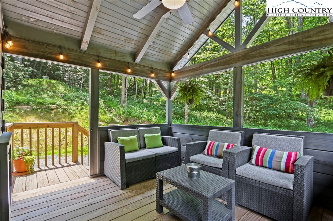 165 John Dotson Road Boone, NC 28607 - Photo 12 of 50 a outdoor living space with furniture and garden view