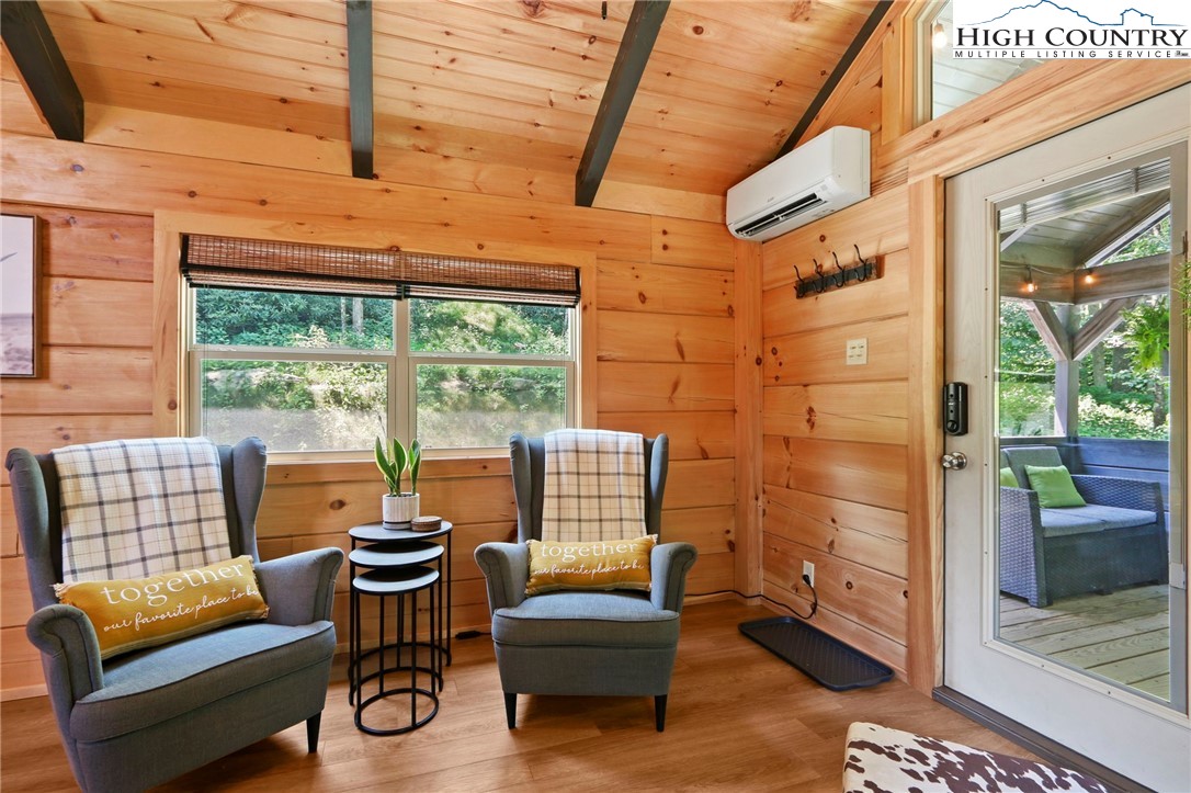 165 John Dotson Road Boone, NC 28607 - Photo 20 of 50 a living room with furniture and a floor to ceiling window