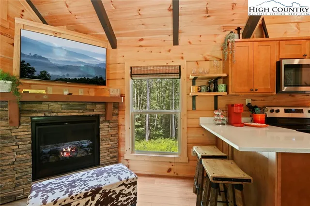 a kitchen with a stove a sink and a microwave