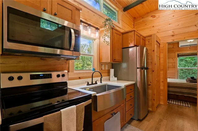 a kitchen that has a sink and a stove