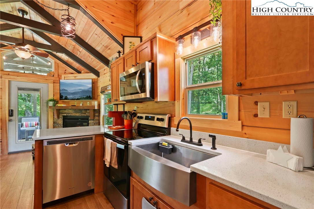 165 John Dotson Road Boone, NC 28607 - Photo 26 of 50 a kitchen that has a sink and a stove