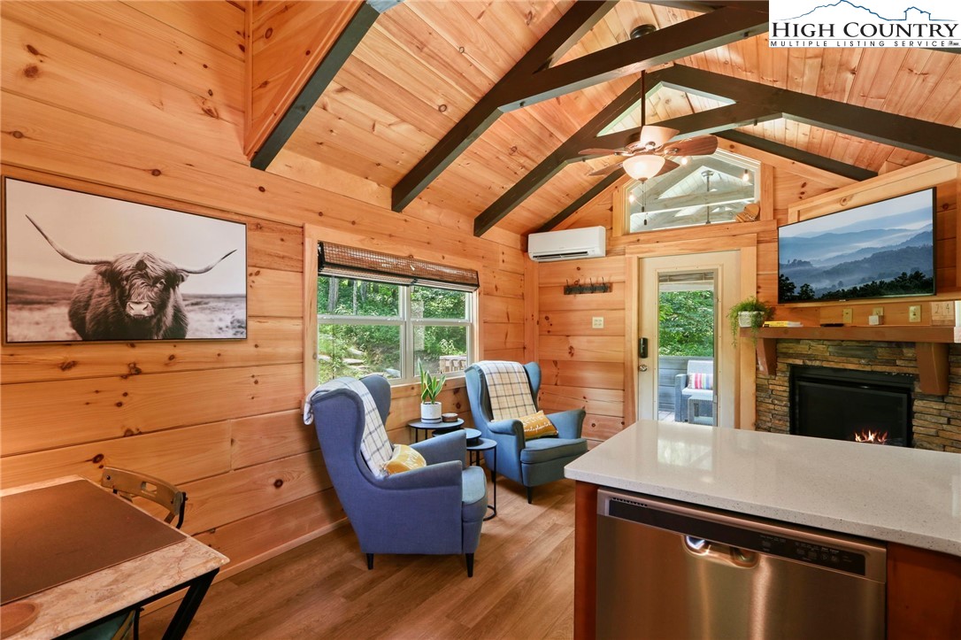 165 John Dotson Road Boone, NC 28607 - Photo 29 of 50 a living room with furniture a fireplace and wooden floor