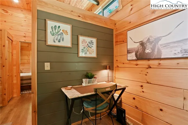 a bedroom with bed and a window