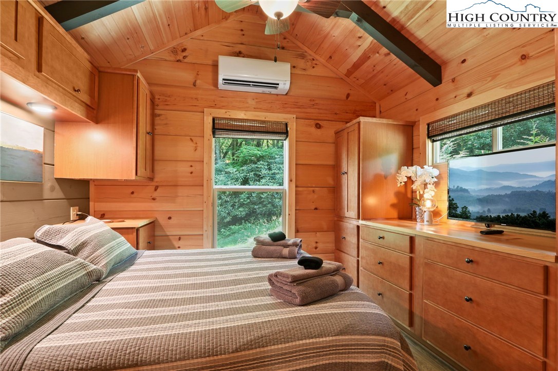 165 John Dotson Road Boone, NC 28607 - Photo 32 of 50 a bedroom with a bed and wooden floor