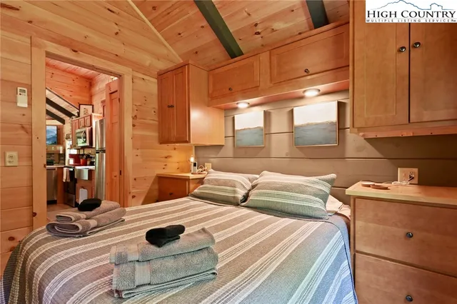 a kitchen with a sink and wooden cabinets